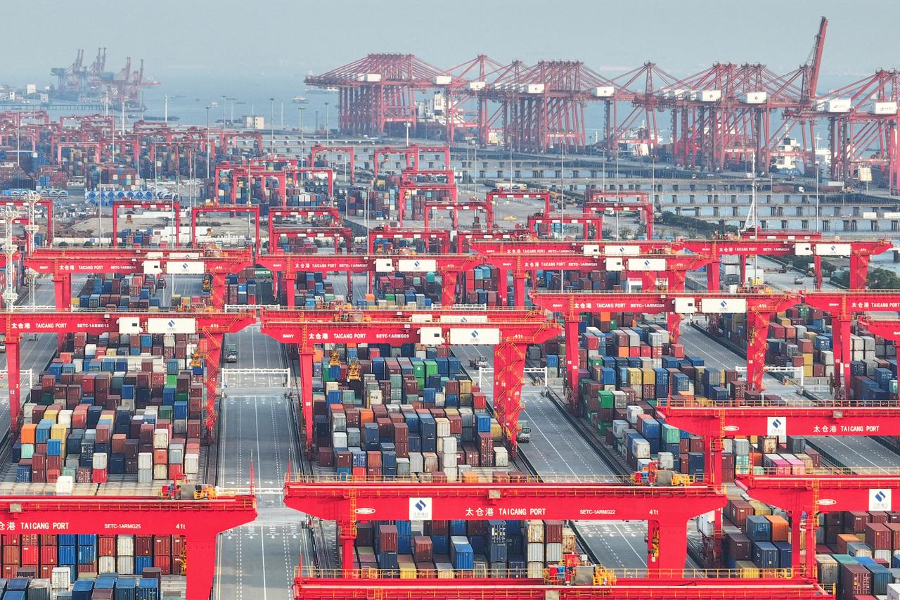 The aerial photo shows containers waiting to be transported at a port in Suzhou, in eastern Chinas Jiangsu province, on May 13, 2025. (AFP Photo)