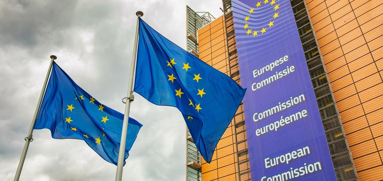 European Union flags fly in front of the European Commission headquarters in Brussels, Belgium, on May 5, 2022. (Adobe Stock Photo)