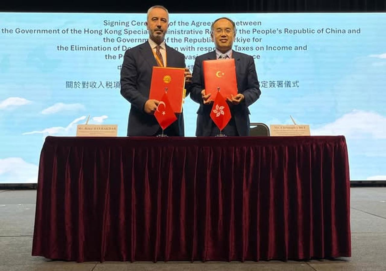 Türkiye’s Revenue Administration President Bekir Bayrakdar and Hong Kong’s Secretary for Financial Services and the Treasury Christopher Lui pose with signed documents after concluding a double taxation avoidance agreement between the two governments, in Hong Kong on September 24, 2024. (Photo via Facebook/hongkongbk)