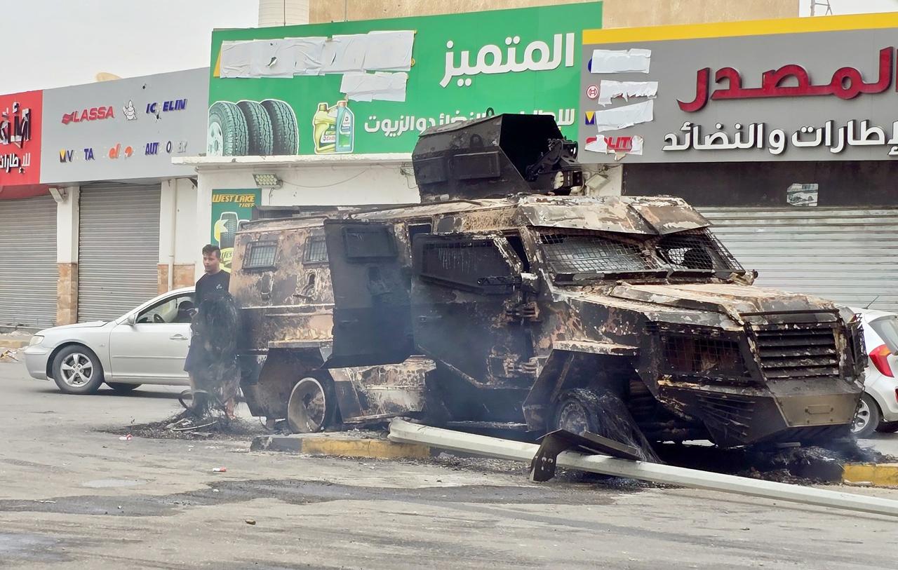 A general view of the a burnt armored military vehicle in clashes between Libyan security forces and the militia group called “Stability Support Apparatus” following the start of the ceasefire in Libyan capital Tripoli on May 14, 2025.  (AA Photo)