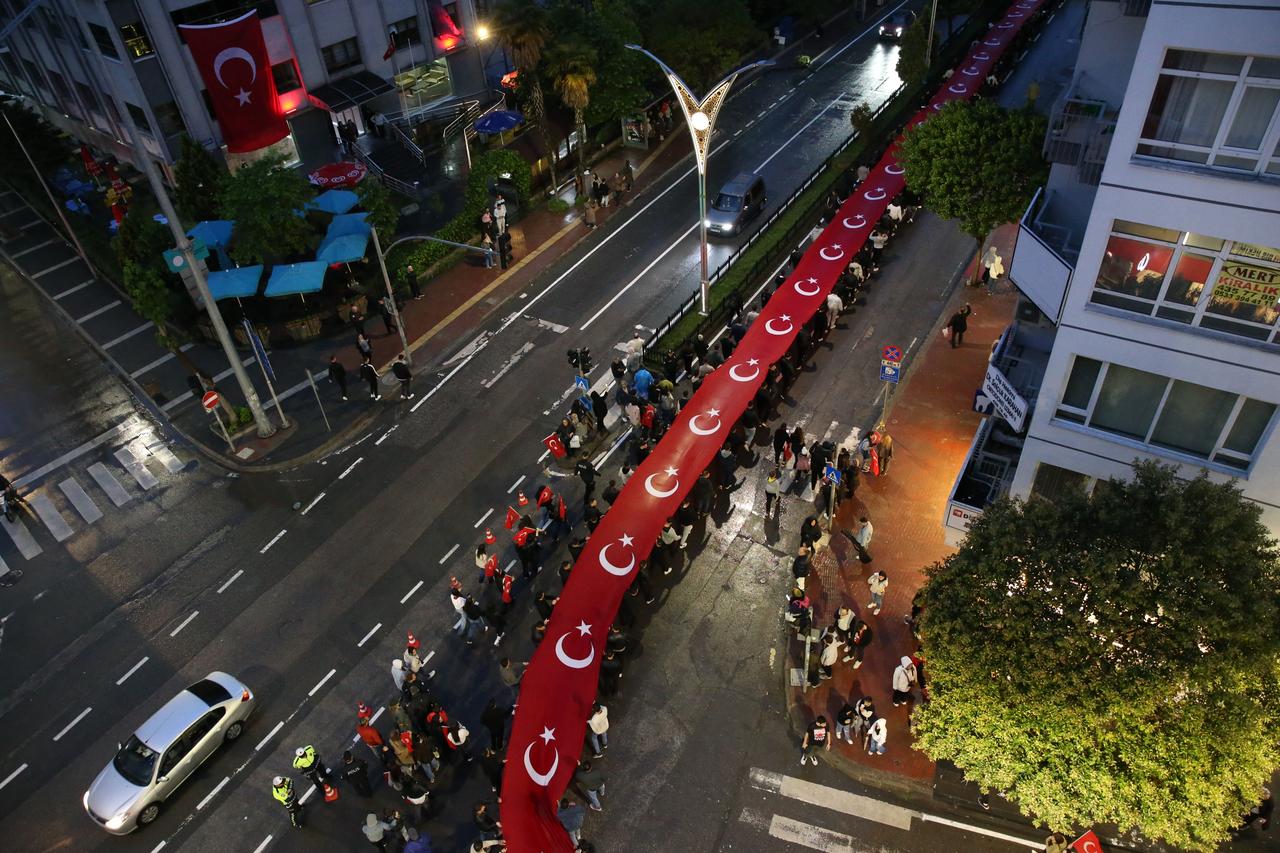 SAMSUN, TURKIYE - MAY 18: An aerial view shows people carrying Turkish flags and portrait of Turkish Republics Founder Mustafa Kemal Ataturk attend the Youth march and festival held in honor of 19th May Commemoration of Ataturk, Youth and Sports Day in Samsun, Turkiye on May 18, 2025. ( Bilal Kahyao?lu - Anadolu Agency )