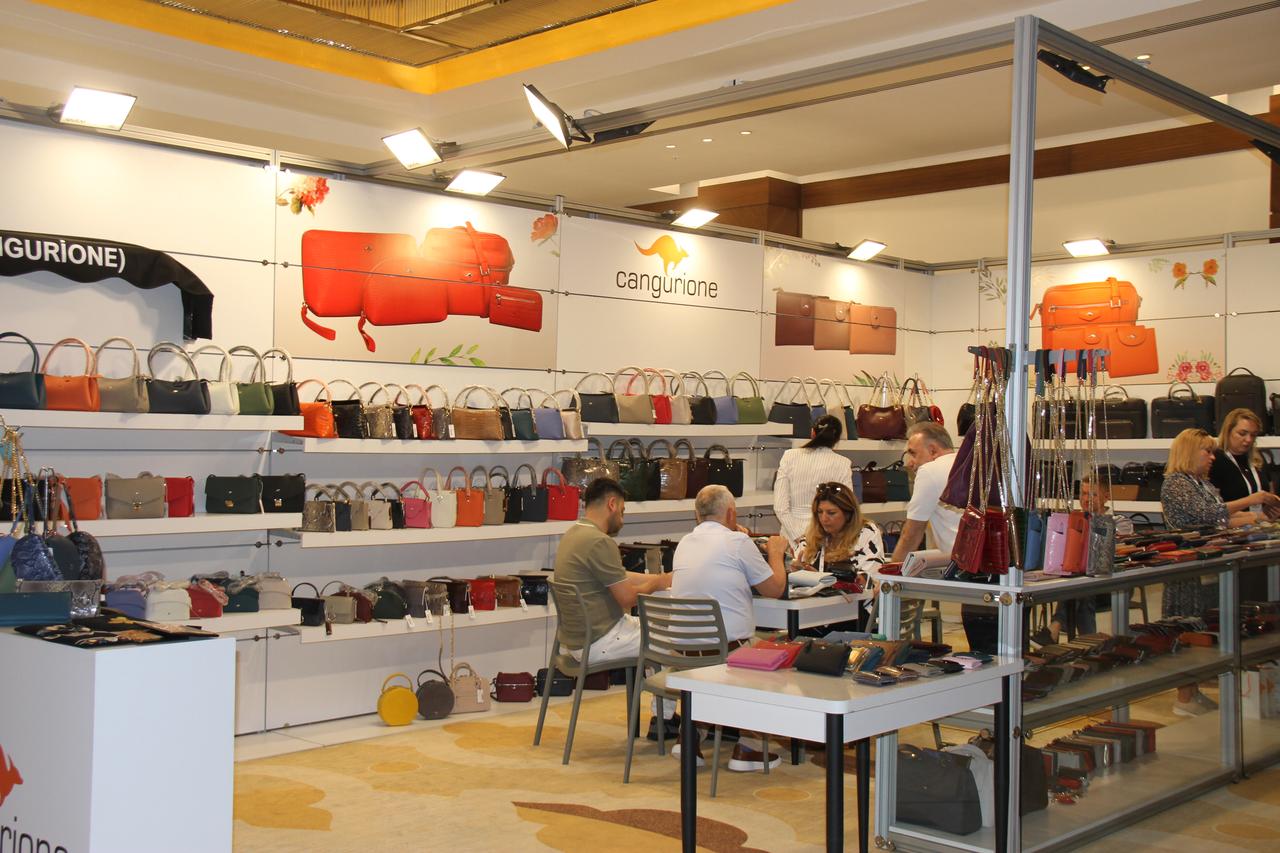 Buyers and Turkish leather brands engage in business talks at a booth during the Antalya Leather and Fur Fashion Show, a key event promoting Türkiye’s leather exports, in Antalya, Türkiye, on May 18, 2025. (AA Photo)