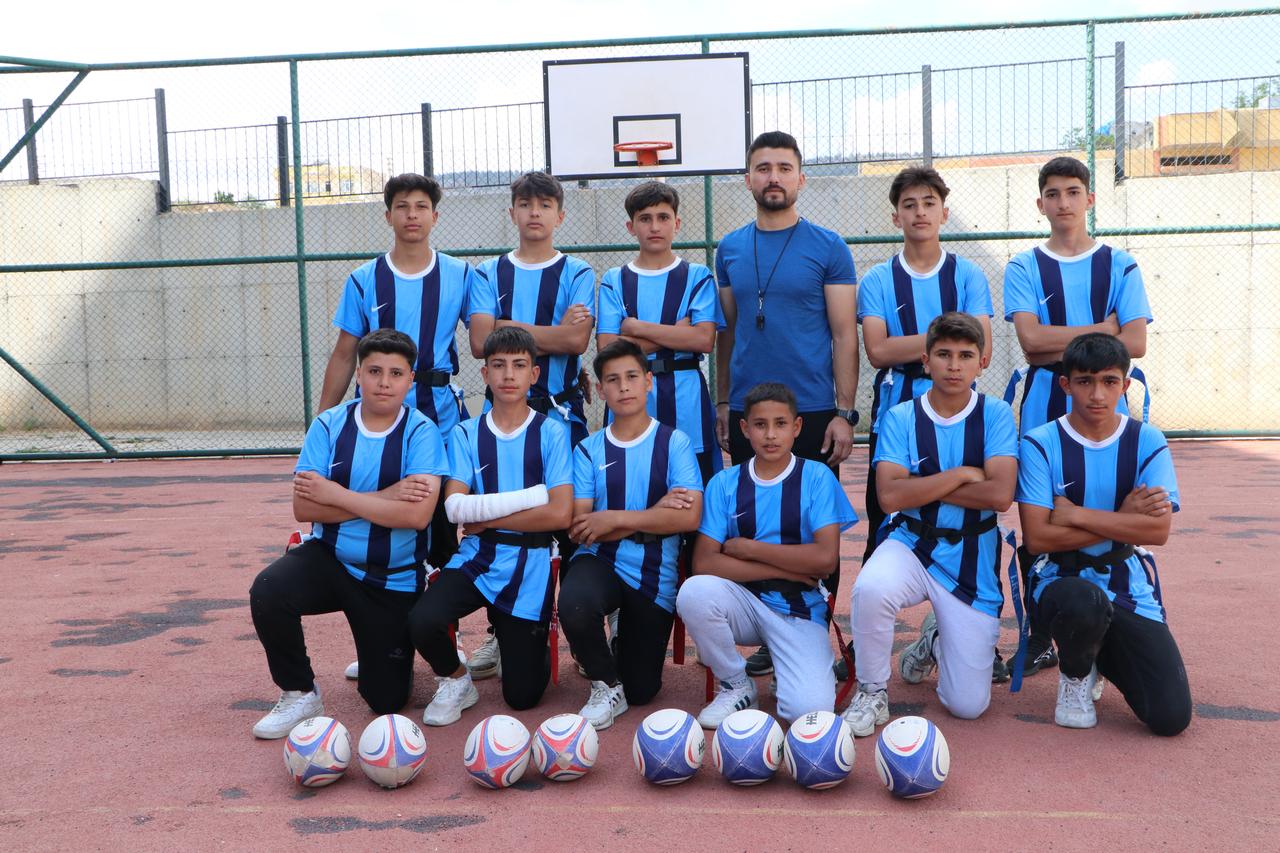 Physical education teacher Erdem Celik (center) poses with his Boys Youth Tag Rugby Team from Kilis, Türkiye on May 19, 2025. (AA Photo)
