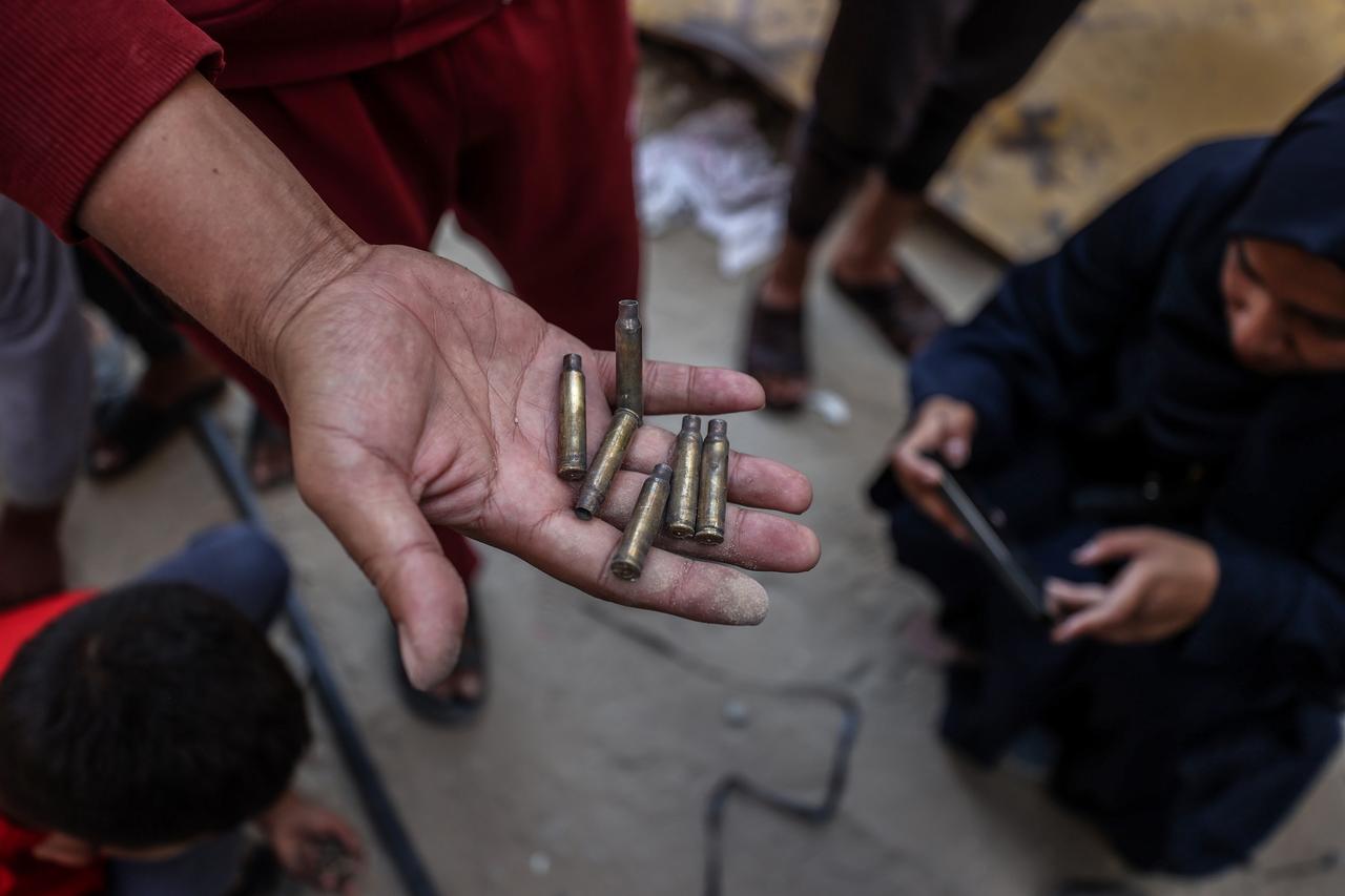 KHAN YUNIS, GAZA - MAY 19: Locals find ammunition scraps as they inspect the house which a special unit of the Israeli army raided with intense fire in the early morning in Khan Yunis, Gaza on May 19, 2025. Locals found remnants of ammunition and clothes left behind for concealment used by Israeli soldiers. ( Ali Jadallah - Anadolu Agency )
