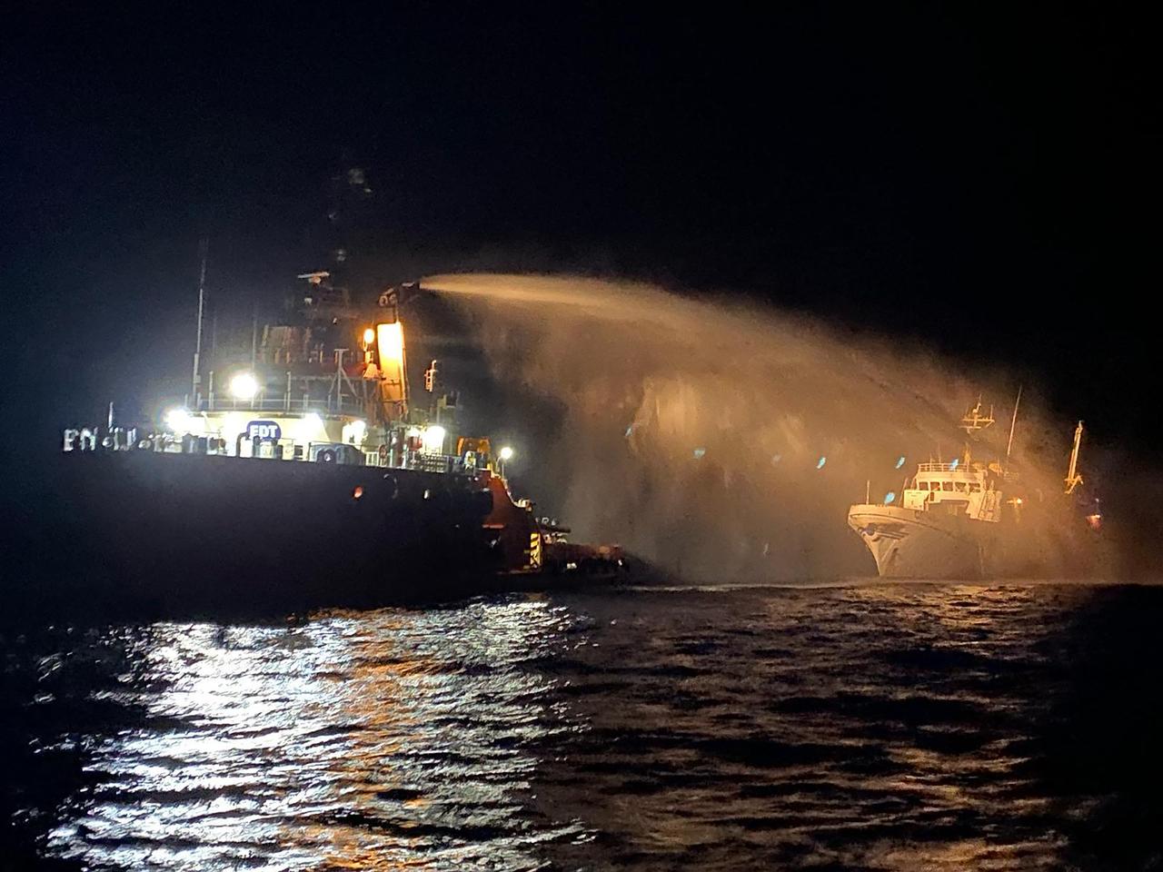 This handout picture released by Malta Government press office on May 2, 2025 shows a Malta Vessel Traffic Services (VTS) vessel doussing the vessel Conscience (R), after they received a distress call reporting a fire on the bow while outside territorial waters. A group of activists organising an aid boat for Gaza said it was attacked on Friday by Israeli drones in international waters off Malta as they headed towards the Palestinian territory. 