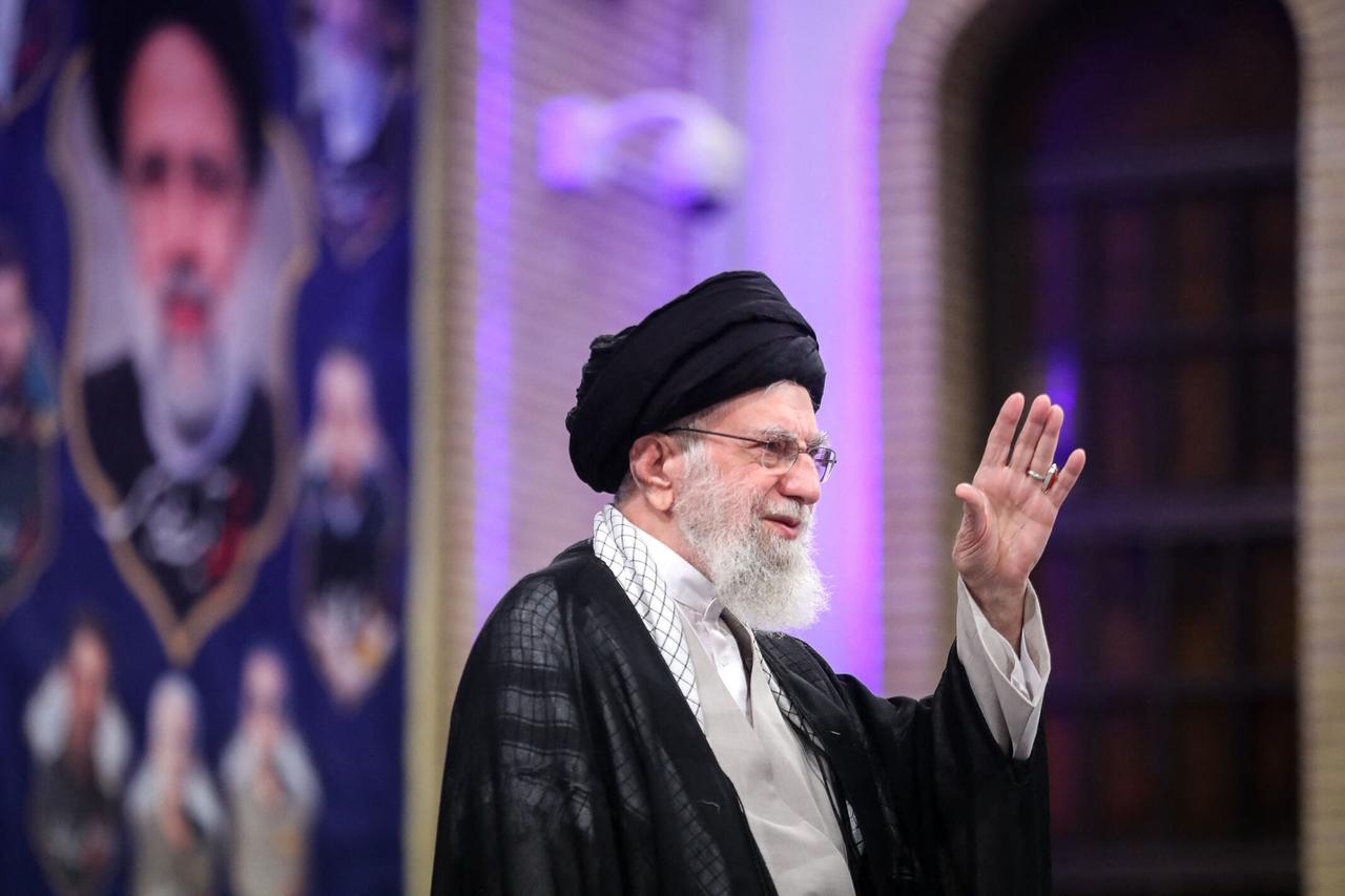 A handout picture provided by the Iranian supreme leader Ayatollah Ali Khamenei’s office shows him addressing the nation on the first anniversary of the death of Irans former president Ebrahim Raisi,  on May 20, 2025 in Tehran. (Photo by KHAMENEI.IR / AFP)