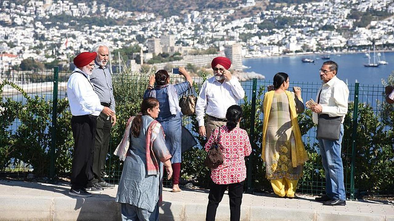 Indian visitors enjoy a panoramic view of Bodrum Castle and the Aegean coastline during a group tour in Mugla, Türkiye, accessed on May 15, 2025. (AA Photo)