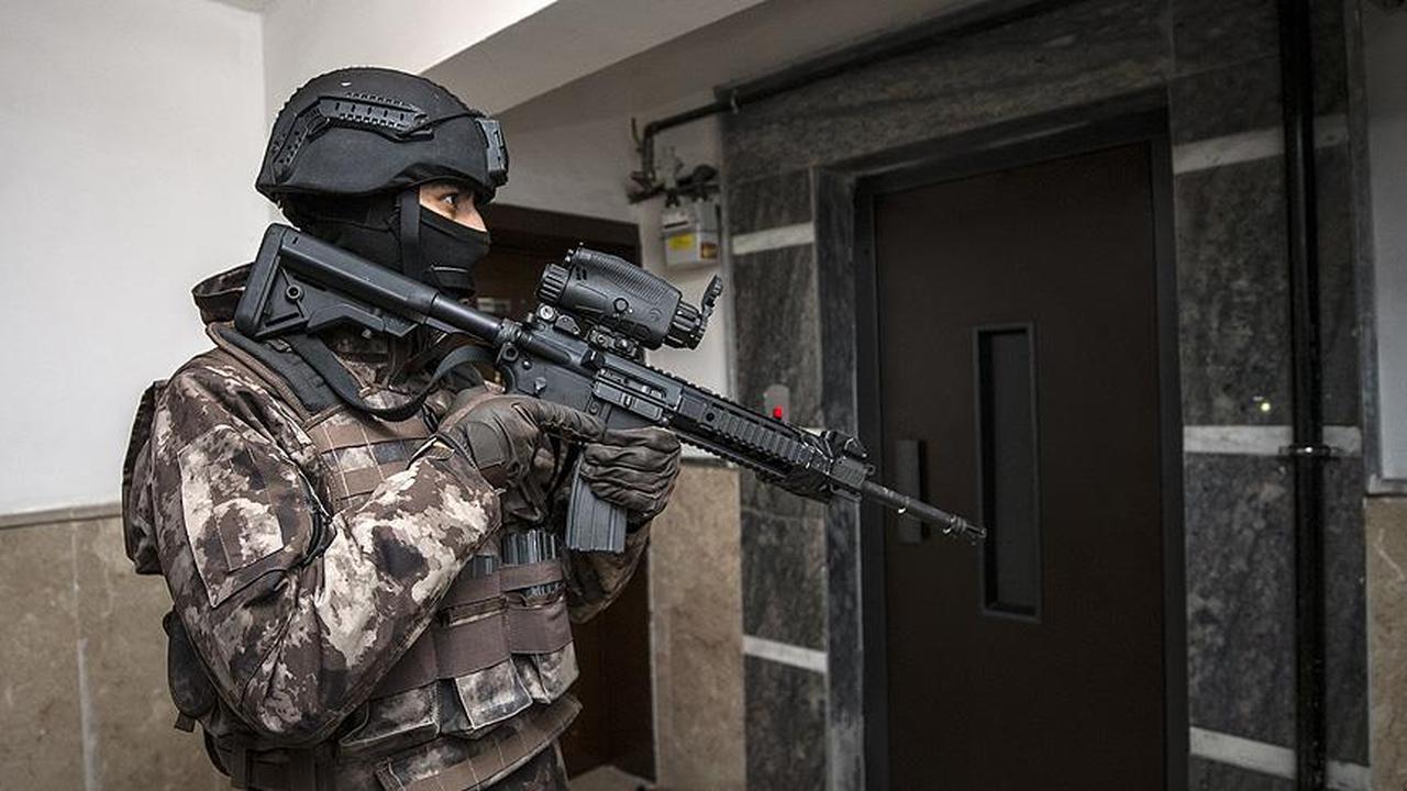 Police Special Operations unit stands in front of an elevator during a operation. (AA Photo)