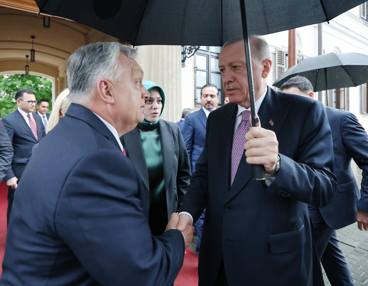 President Recep Tayyip Erdogan, who visited Hungary for the Informal Summit of the Heads of State of the Organization of Turkic States, shakes hands with Hungarian Prime Minister Victor Orban in Budapest, Hungary on May 21, 2025.  ( TUR Presidency/ AA Photo)