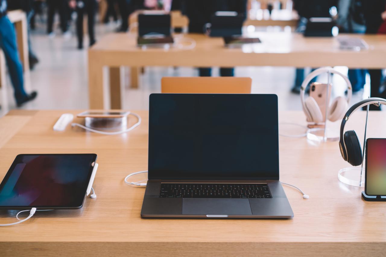 A lineup of laptops, tablets, and headphones at the Apple Park Visitor Center in Cupertino, California on November 17, 2018. (Adobe Stock Photo)