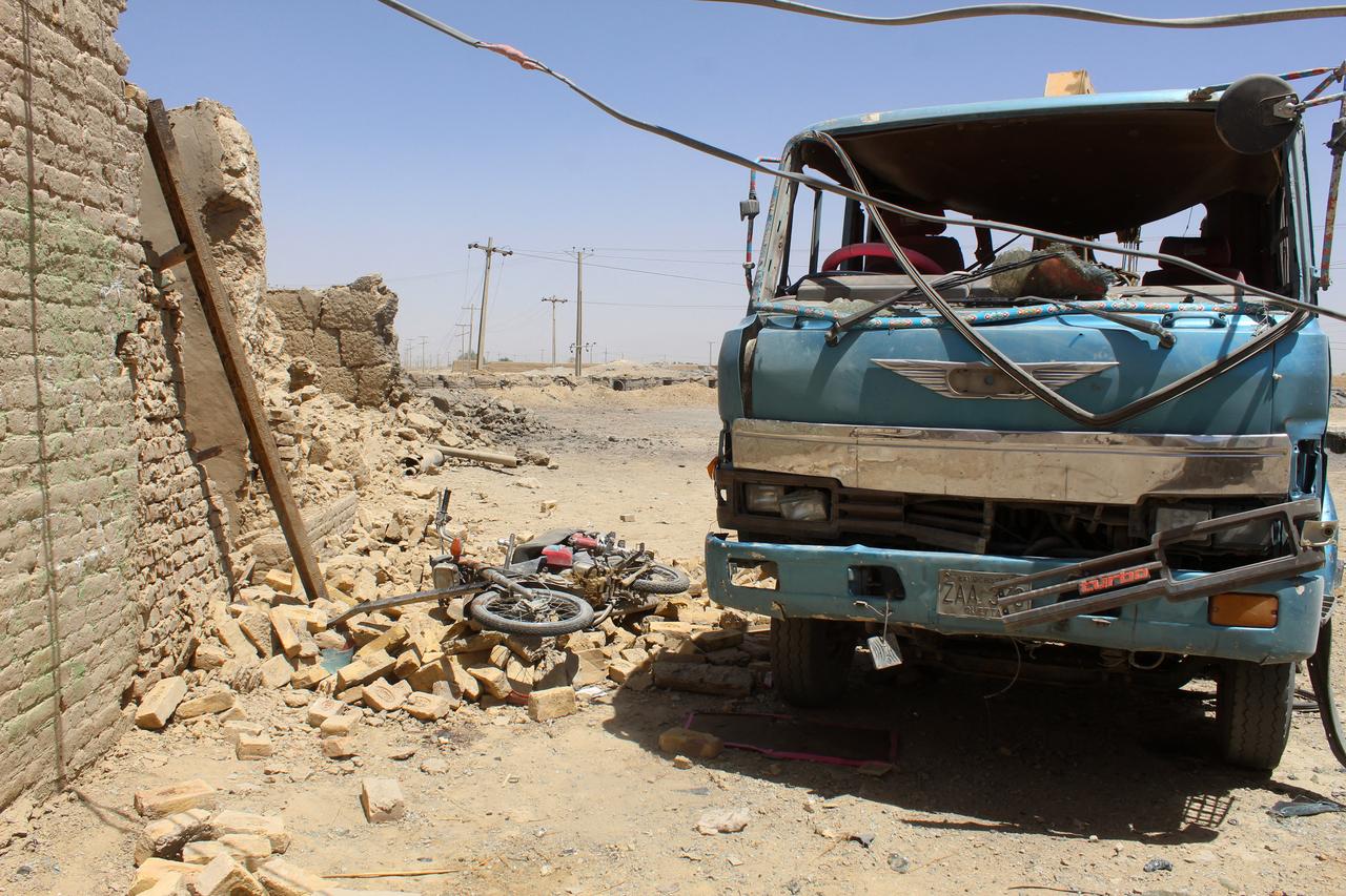 A general view shows damaged vehicles at the site a day after a bomb blast in Qila Abdullah, in Balochistan province, on May 19, 2025. (AFP Photo)