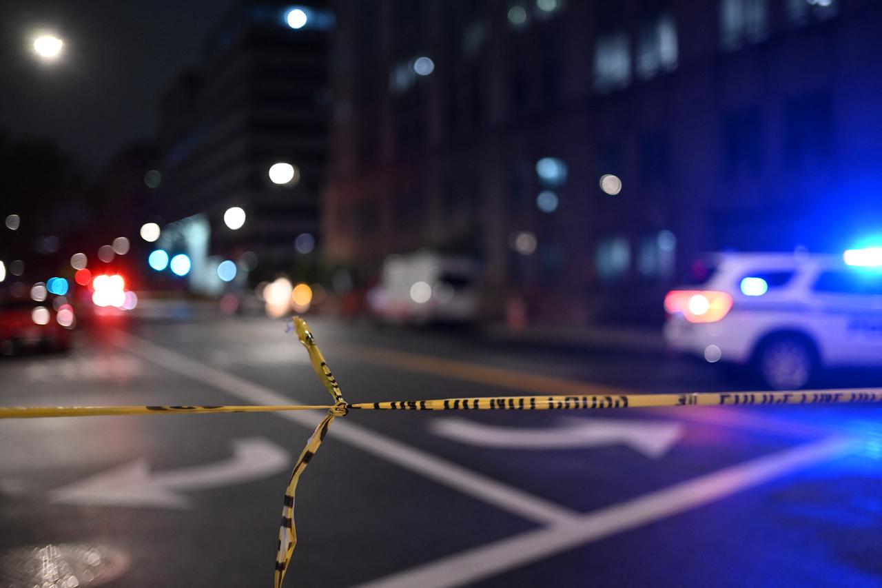Police tape cordons off the street outside the Capital Jewish Museum following a shooting that left two people dead, in Washington, DC, in the early hours of May 22, 2025. Two Israeli embassy staffers were shot dead late Wednesday, May 21, outside a Jewish museum in Washington by a gunman who shouted  free Palestine,  authorities said, with US officials and Israeli diplomats expressing shock and outrage over the killings. (Photo by Alex WROBLEWSKI / AFP)