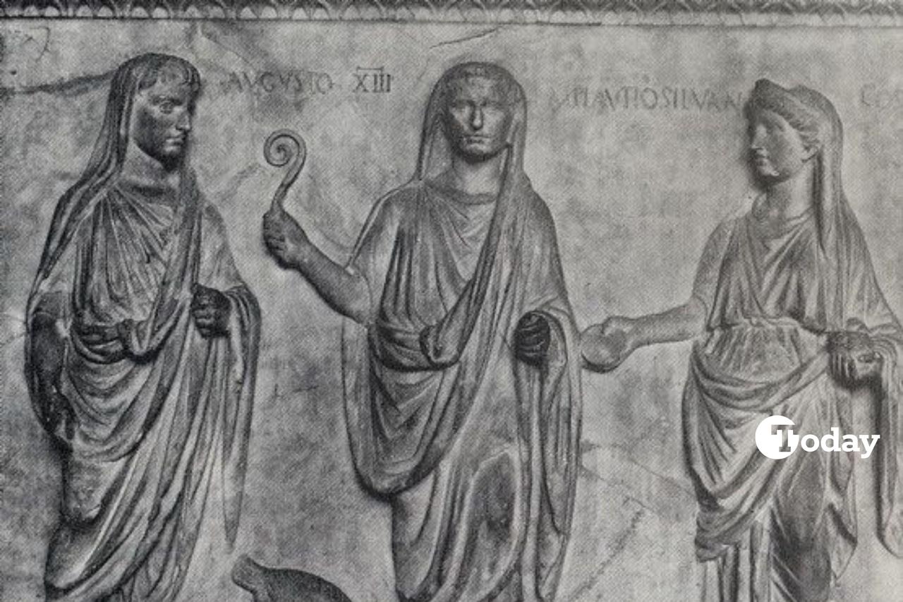 Augustus shown as an augur; his head is covered and he carries the lituus in his hand to show his office as one of the augurs and taking the auspices. (Photo via Brewminate)