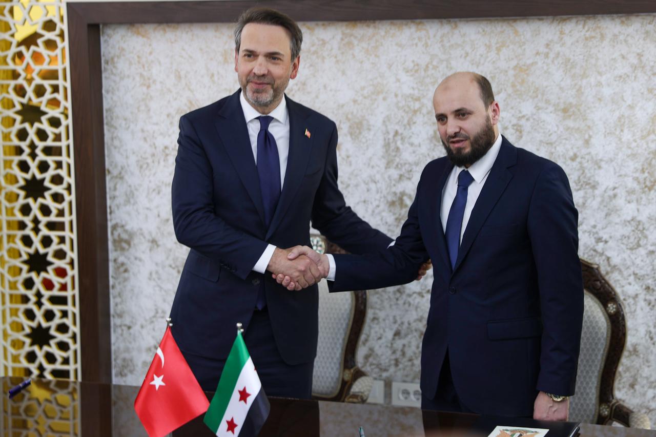 DAMASCUS, SYRIA - MAY 22: Turkish Energy and Natural Resources Minister Alparslan Bayraktar (L) meets Syrian Energy Minister Mohammad Bashir (R) in Damascus, Syria, on May 22, 2025. After the talks, the two countries signed a cooperation agreement covering energy, mining and hydrocarbons. ( ?zettin Kas?m - Anadolu Agency )