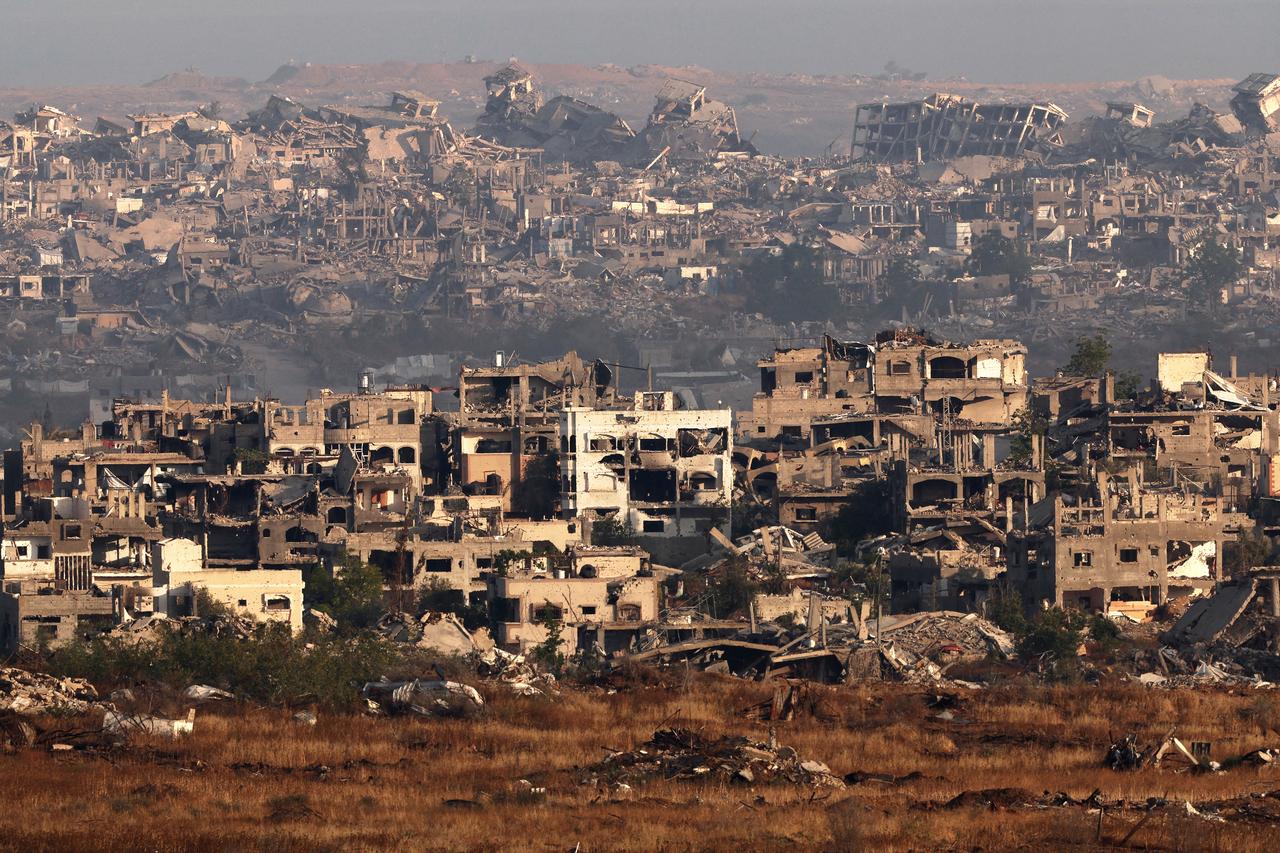 A picture taken from the Israeli side of the border with the Gaza Strip shows destroyed buildings in the nothern sector of the besieged Palestinian territory on May 22, 2025, 19 months after the war broke out between Israel and the Hamas movement. The UN said on May 22 it had  dispatched  around 90 trucks carrying aid into Gaza, as international pressure intensified over Israels renewed offensive and blockade of the war-ravaged Palestinian territory. (Photo by Jack GUEZ / AFP)