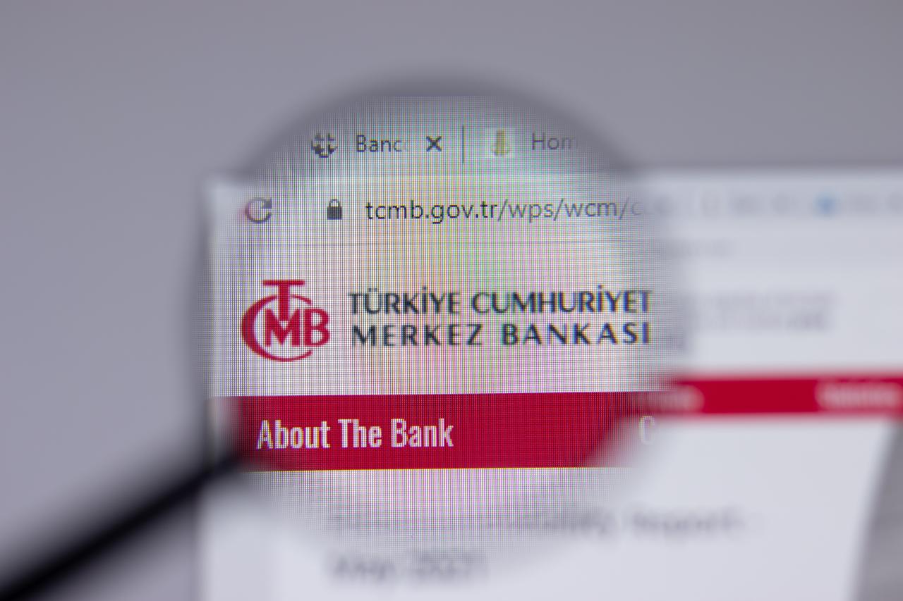 Photo illustration shows a close-up view through a magnifying glass showing the Central Bank of the Republic of Türkiye (TCMB) logo and website header on a computer screen in Los Angeles, US, on June 1, 2021. (Adobe Stock Photo)