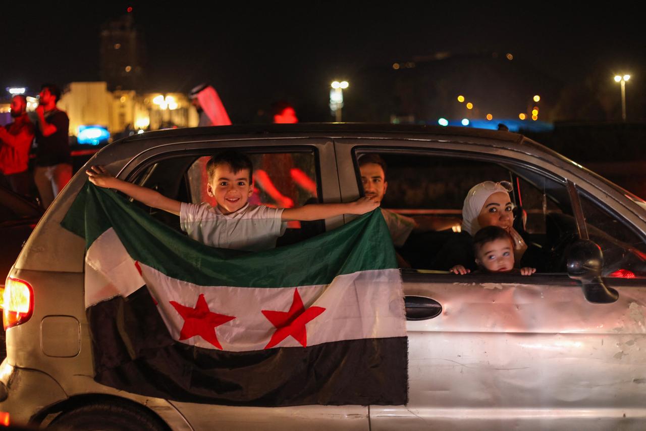 People celebrate in Damascus' Omeyyad square after U.S. President Donald Trump's decision to lift sanctions in Syria, on May 13, 2025. (AFP Photo)