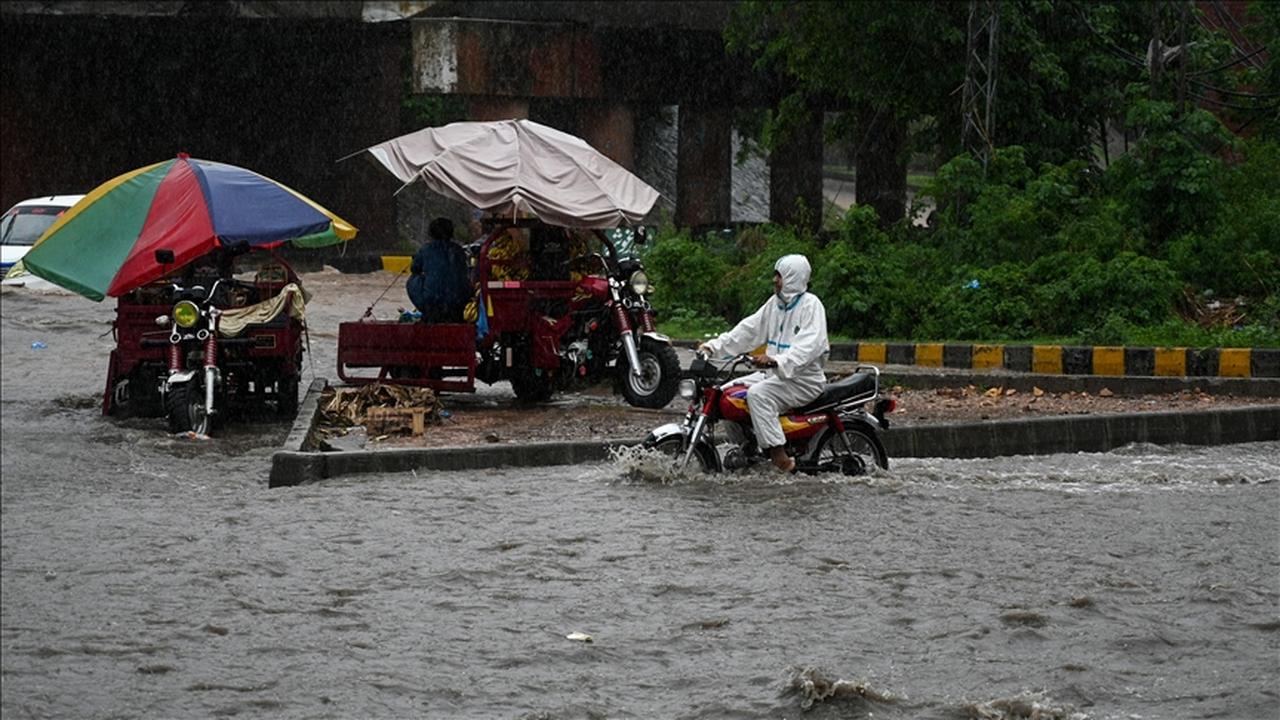 Motorcyclist navigates through a flooded street as heavy rain lashes parts of Punjab, Pakistan on May 24, 2025. (AA Photo)