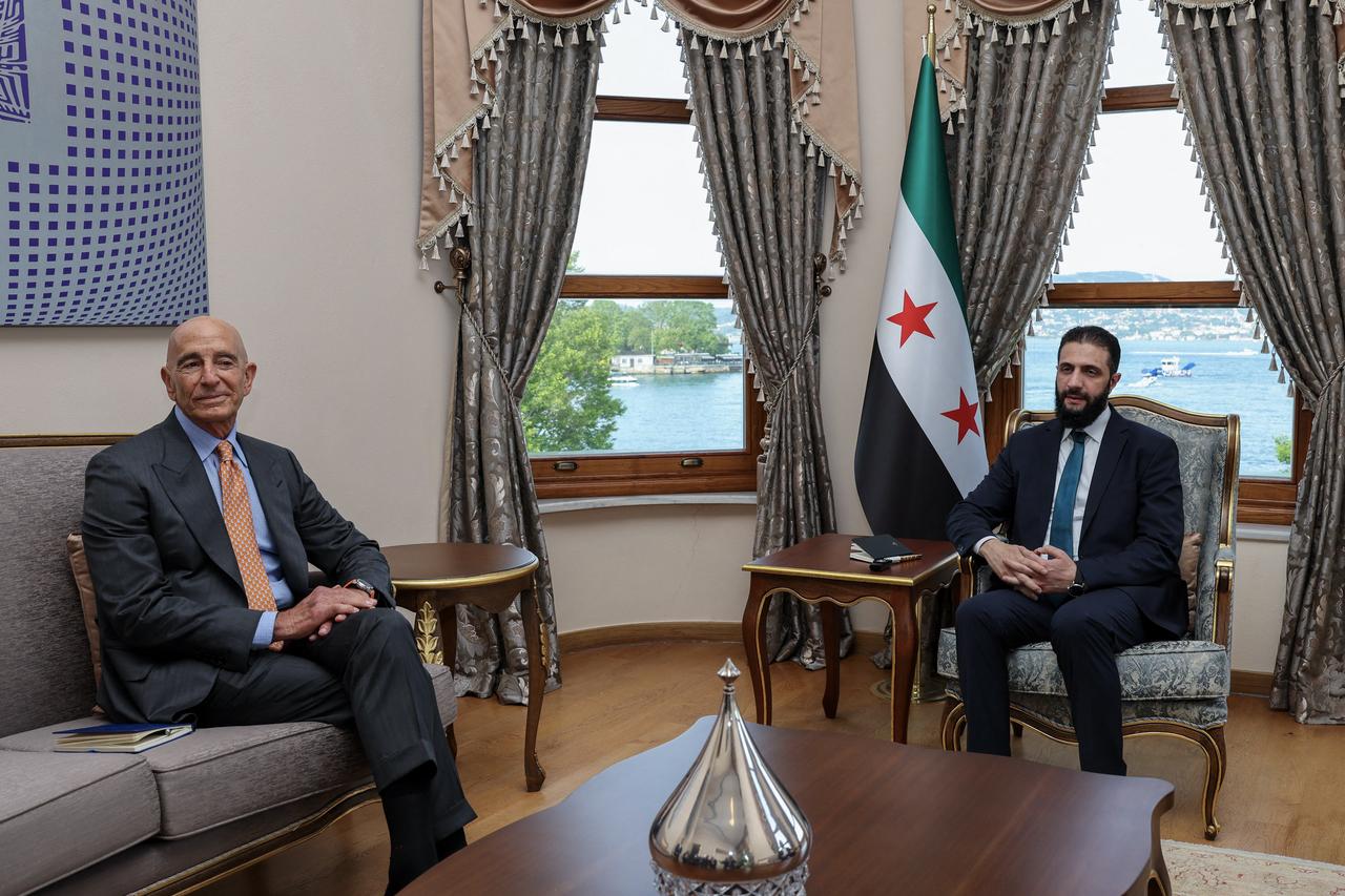 This handout photograph taken and released by Turkish Foreign Ministry press service on May 24, 2025, shows US Ambassador to Turkey Thomas Barrack (L) during a meeting with Syrias jihadist-turned-interim President Ahmed al-Sharaa in Istanbul. (Photo by Handout / TURKISH FOREIGN MINISTRY / AFP) / RESTRICTED TO EDITORIAL USE - MANDATORY CREDIT  AFP PHOTO / TURKISH FOREIGN MINISTRY/HANDOUT  - NO MARKETING NO ADVERTISING CAMPAIGNS - DISTRIBUTED AS A SERVICE TO CLIENTS