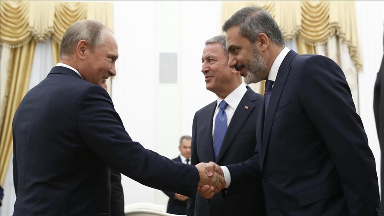 Foreign Minister Hakan Fidan shaking hands with Russian President Vladimir Putin in Moscow, Russia, accessed on May 26, 2025. (AA Photo)