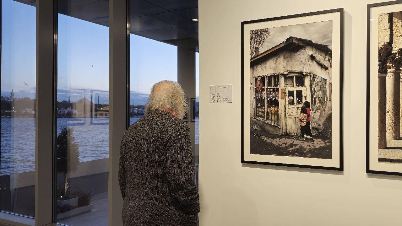 A guest views a nostalgic photograph at Izzet Keribar's exhibition in Istanbul Modern, where Türkiye’s past comes alive through timeless images, November 11, 2024. (Photo via Türkiye daily)