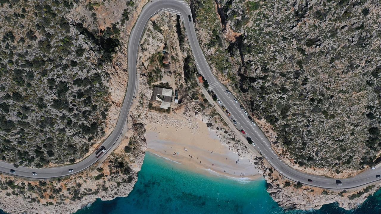  A drone photo shows an aerial view of Kaputas Beach as people enjoy the warm temperature with sea and sand during a sunny day in Kas district of Antalya, Turkey on February 24, 2021. (AA Photo)