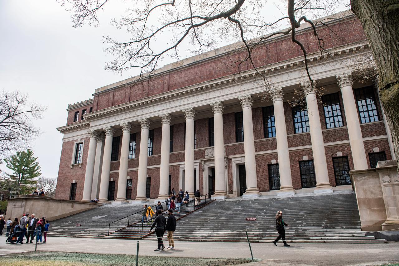 People enter and exit the Harry Elkins Widener Memorial Library on the Harvard University campus in Cambridge, Massachusetts, on April 15, 2025.  (AFP Photo)