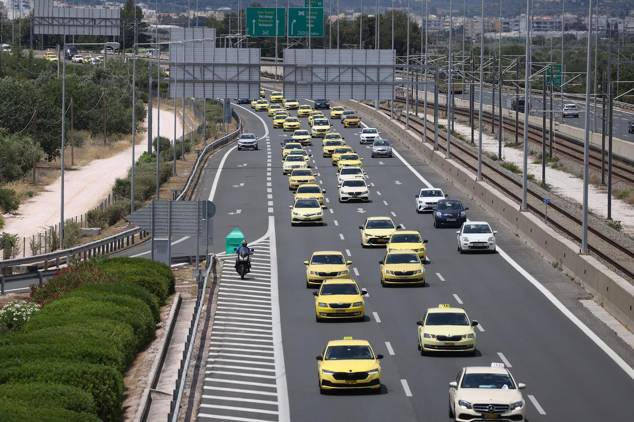 A view of a convoy of taxis driving on a highway during a demonstration as part of a 48-hour strike near Eleftherios Venizelos International Airport in Athens, Greece, May 28, 2025. (AA Photo)
