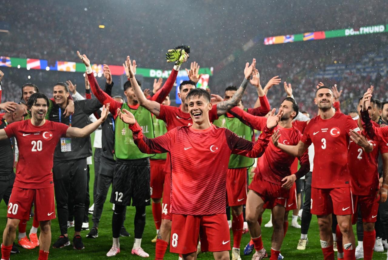 Turkish players celebrate after beating Georgia 3-1 in their EURO 2024 Group F opener in Dortmund, Germany, June 18, 2024. (AA Photo)