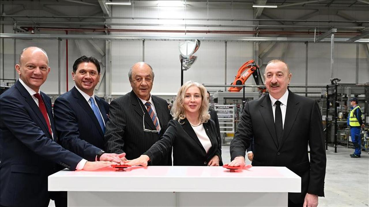 Azerbaijani President Ilham Aliyev joins Coca-Cola Icecek and Anadolu Group executives during the inauguration ceremony of CCI’s new production facility in Ismayilli, Azerbaijan, on May 27, 2025. (AA Photo)