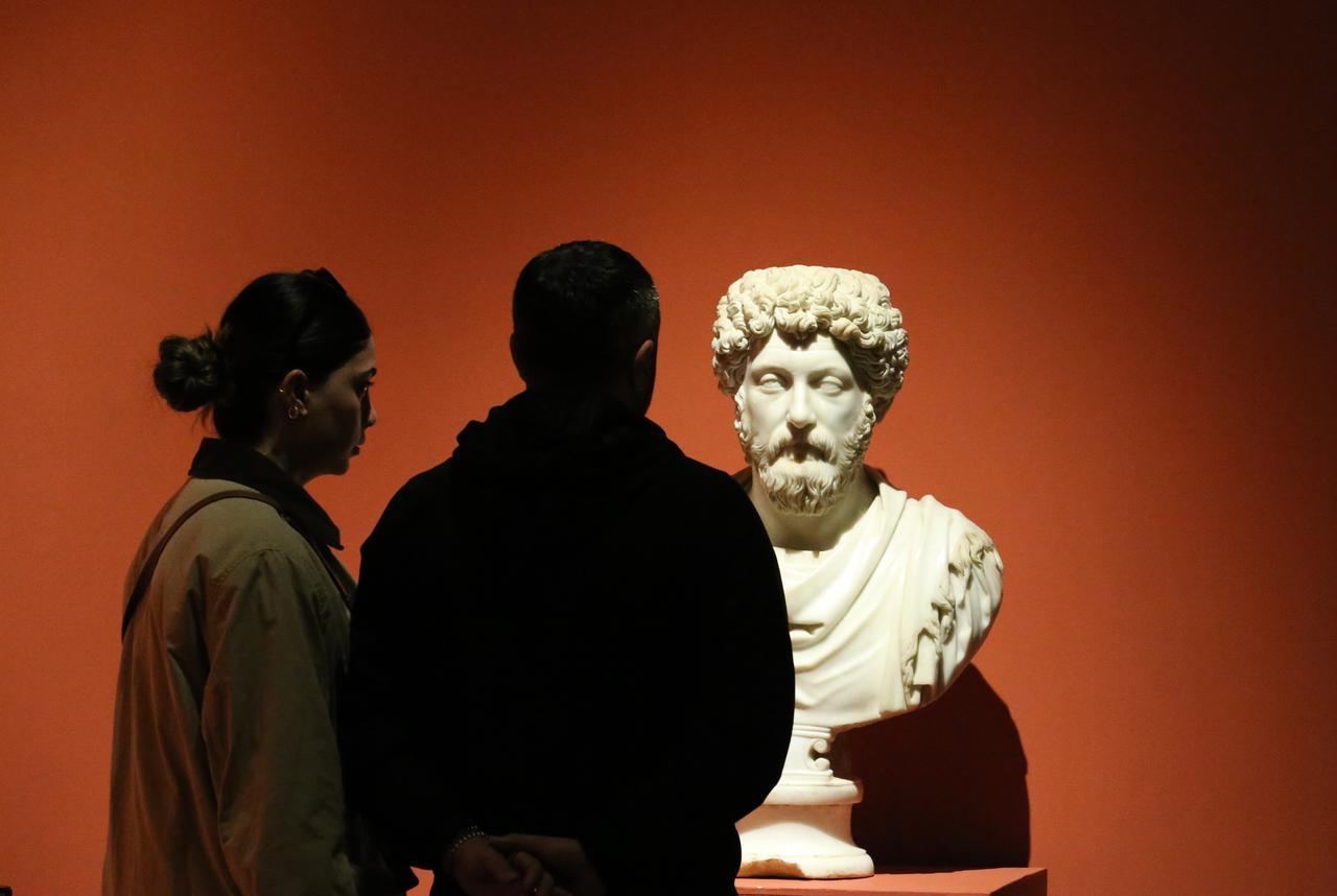 A bust of Roman Emperor and philosopher Marcus Aurelius is examined by visitors at the Ephesus Museum in Selcuk, Izmir, May 1, 2025. (AA Photo)