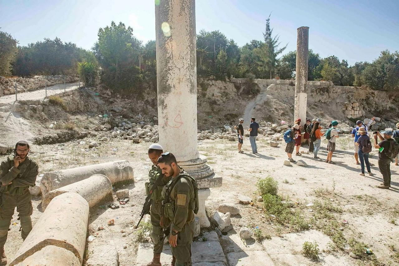 Israeli soldiers walk around the Sebastia archaeological site in the Palestinian West Bank, May 7, 2023 (Photo by Haaretz)