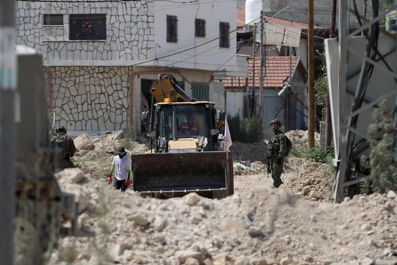 TULKARM, WEST BANK - MAY 26: Israeli army with vehicles are seen around the residential area as Israeli army continues its persecution of evictions and demolitions for the fifth month at the Tulkarm Refugee Camp in Tulkarm, West Bank on May 26, 2025. In the face of the demolition and evacuation operations that entered its fifth month, Tulkerim Refugee Camp has turned into a “ghost town”. ( ?ssam Rimawi - Anadolu Agency )