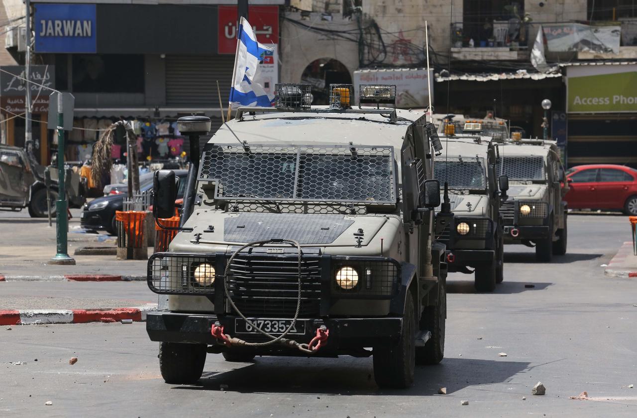 NABLUS, WEST BANK - MAY 27: Israeli military vehicles patrol on street during a clash between Israeli forces and Palestinians, reacting to the raid, in Nablus, West Bank on May 27, 2025. 4 Palestinians were wounded in a raid organized by the Israeli army. ( Nedal Eshtayah - Anadolu Agency )