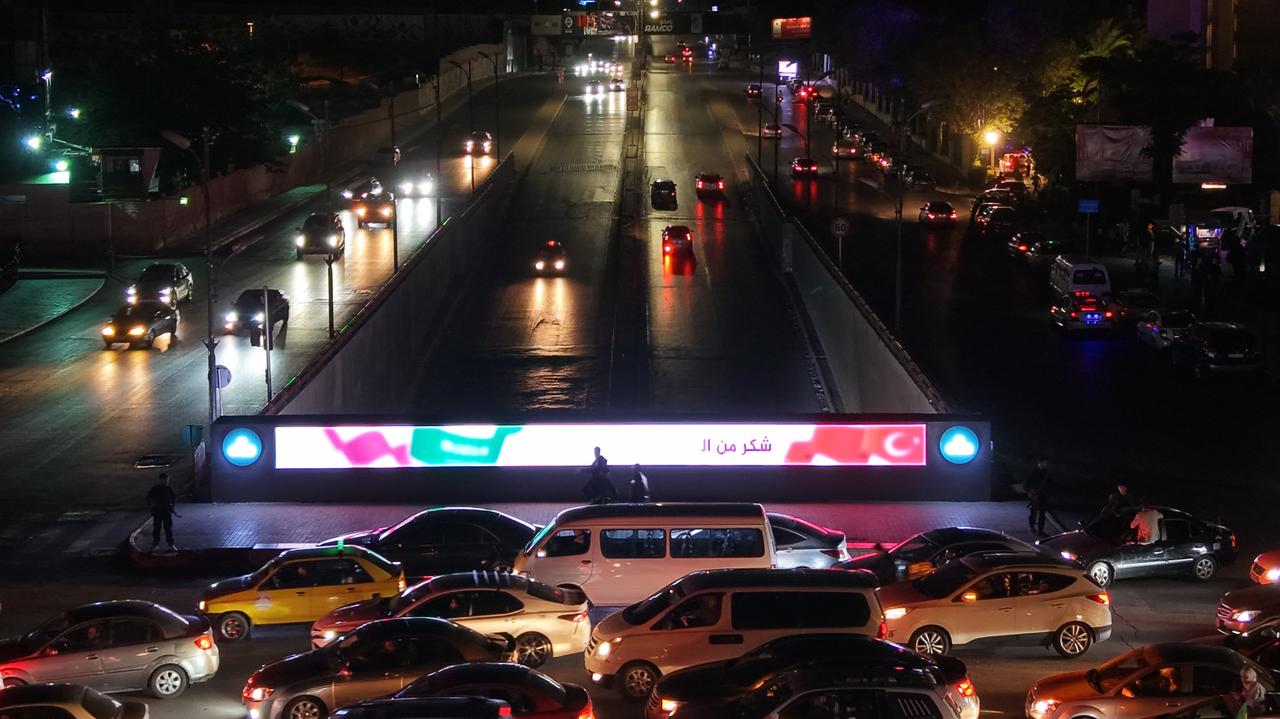 An aerial view of the area shows traffic congestion and celebrations in Damascus’s Umayyad Square after Syrian President Ahmed al-Shara addressed the nation on state television channel on May 14, 2025. Following al-Shara's speech, crowds gathered in the square to show their support, with scenes of celebrations and heavy traffic captured by drone. (AA Photo)