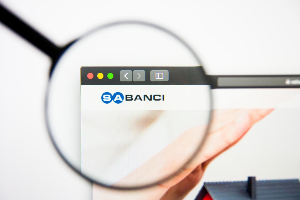 Photo illustration shows Sabanci Holding’s website viewed through a magnifying glass in Los Angeles, California, on March 5, 2019. (Adobe Stock Photo)