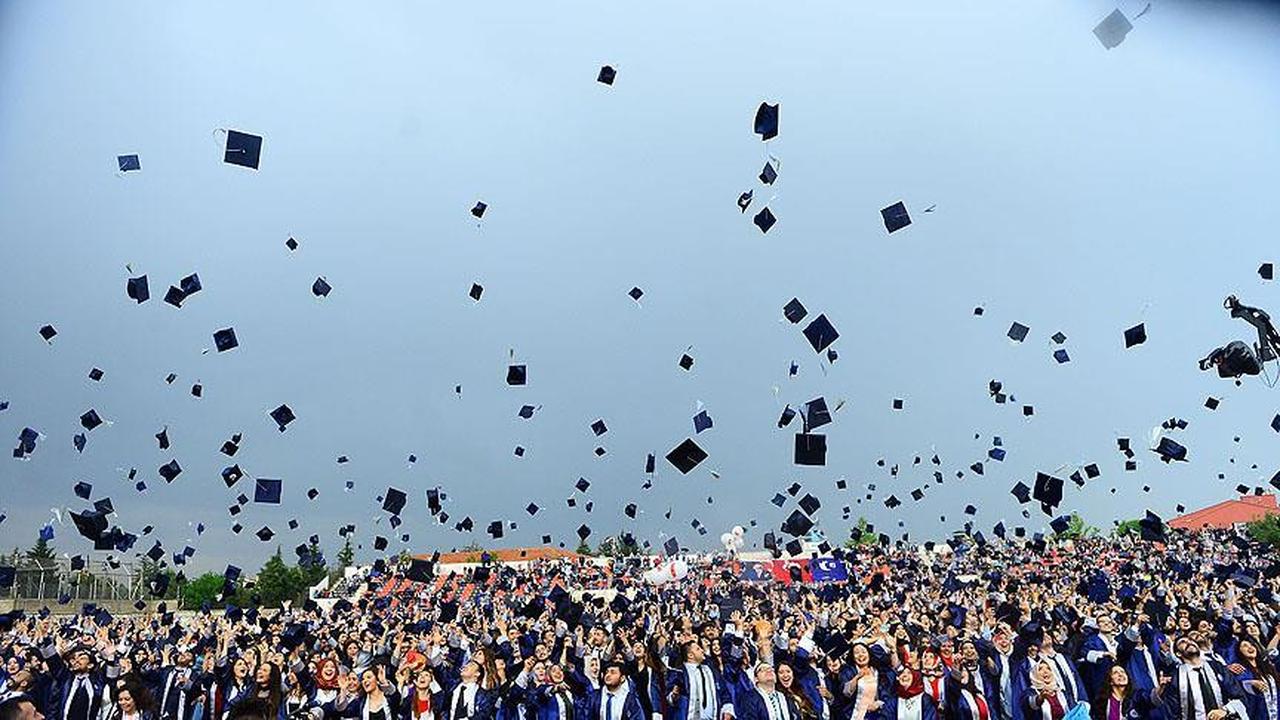 University graduates celebrate by tossing their caps during a commencement ceremony in Türkiye, accessed on May 29, 2025. (AA Photo)