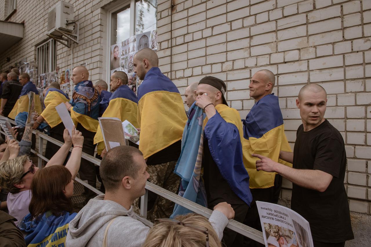 UKRAINE - MAY 25: Recently released Ukrainian prisoners of war are seen after being freed as part of the third and final round of the large-scale “1,000-for-1,000” prisoner swap between Ukraine and Russia, in North Ukraine, on May 25, 2025. A total of 303 Ukrainian defenders were released from Russian captivity as part of the swap, which was facilitated by TUrkiye earlier in May. The released servicemen include members of various branches of the Ukrainian Armed Forces, including 70 defenders of Mariupol. Since the start of Russia’s full-scale invasion in 2022, 65 exchanges have taken place, with 5,757 Ukrainians freed. The three-day exchange operation, confirmed by both Moscow and Kyiv, brought renewed hope to families still awaiting news of the missing. ( Andre Luis Alves - Anadolu Agency )