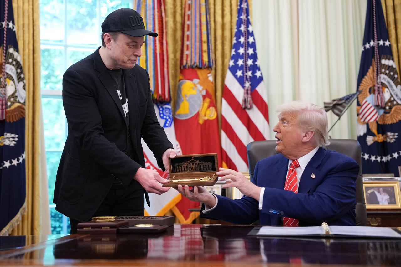 Tesla CEO Elon Musk receives a key from U.S. President Donald Trump in the Oval Office of the White House in Washington, U.S. on May 30, 2025. (AFP Photo)