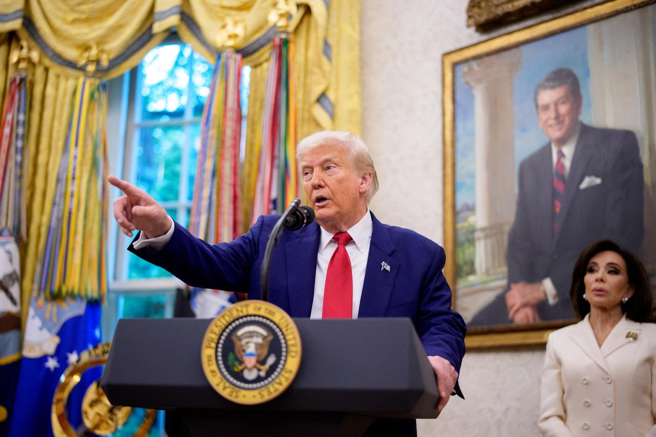 U.S. President Donald Trump takes a question during a swearing in ceremony for interim U.S. Attorney for Washington, D.C. Jeanine Pirro (R) in the Oval Office of the White House on May 28, 2025 in Washington, DC. (AFP Photo)