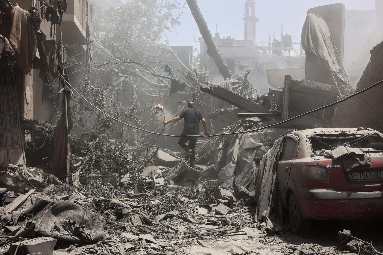 A Palestinian man inspects the rubble following Israeli strikes on the al-Qattaa family home in al-Tuffah neighbourhood in Gaza City on May 31, 2025. (AFP Photo)