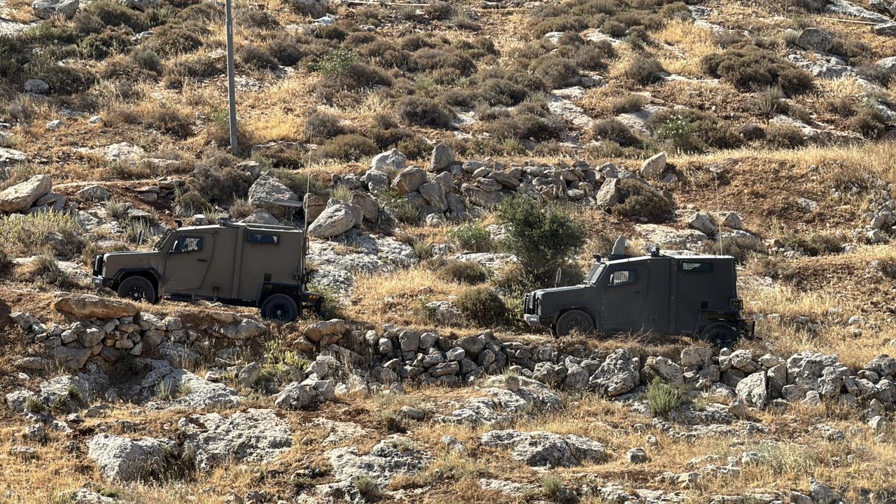 RAMALLAH, WEST BANK - MAY 29: Israeli military vehicles patrol as the Israeli army used heavy machinery to demolish a house belonging to Palestinian Anwar Samih Nasan in the village of al-Mugayyir, near the city of Ramallah, West Bank on May 29, 2025. ( Hisham K. K. Abu Shaqra - Anadolu Agency )