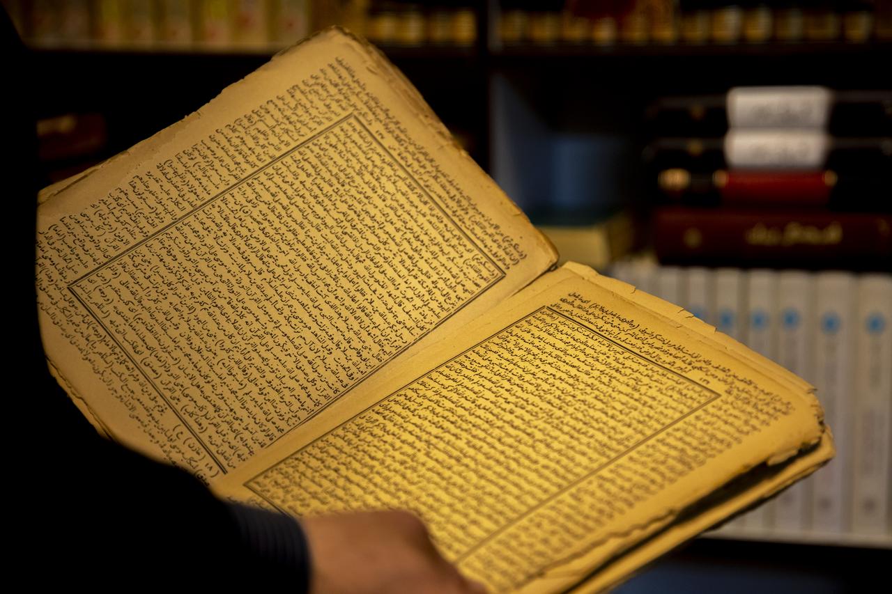 Historical manuscripts, including the 7-century-old poetry of the Seljuk poet Enveri and books printed in the name of the Ottoman Sultan Abdulaziz, are preserved with great care at the Sufi lodge in the Shaqlawa district of the Erbil, Iraq, April 13, 2025. (AA Photo)