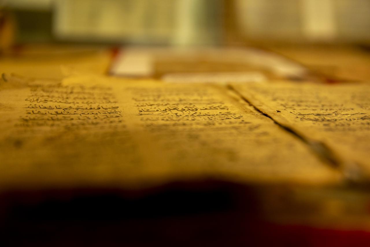 Historical manuscripts, including the 7-century-old poetry of the Seljuk poet Enveri and books printed in the name of the Ottoman Sultan Abdulaziz, are preserved with great care at the Sufi lodge in the Shaqlawa district of the Erbil, Iraq, April 13, 2025. (AA Photo)