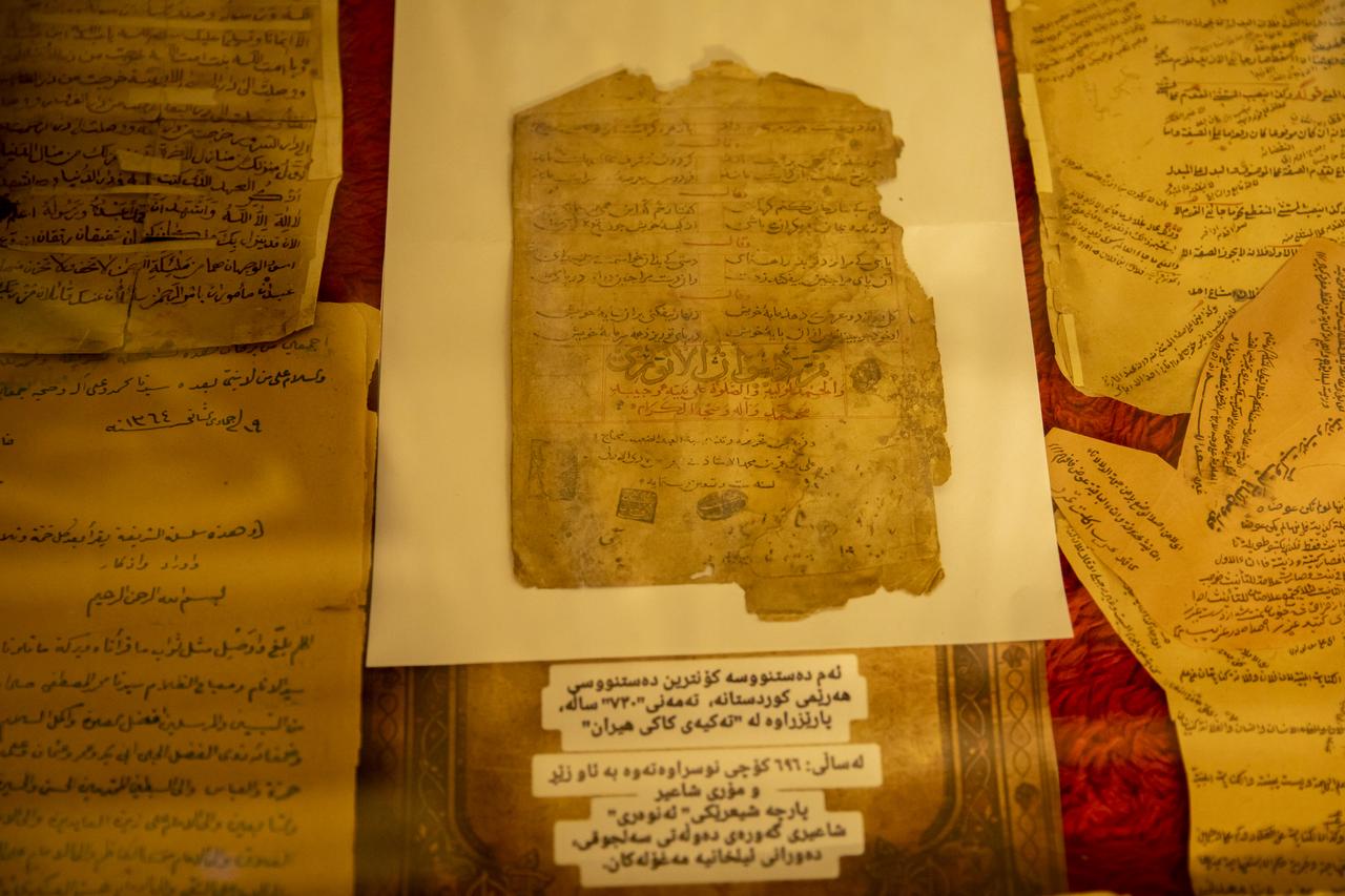 Historical manuscripts, including the 7-century-old poetry of the Seljuk poet Enveri and books printed in the name of the Ottoman Sultan Abdulaziz, are preserved with great care at the Sufi lodge in the Shaqlawa district of the Erbil, Iraq, April 13, 2025. (AA Photo)