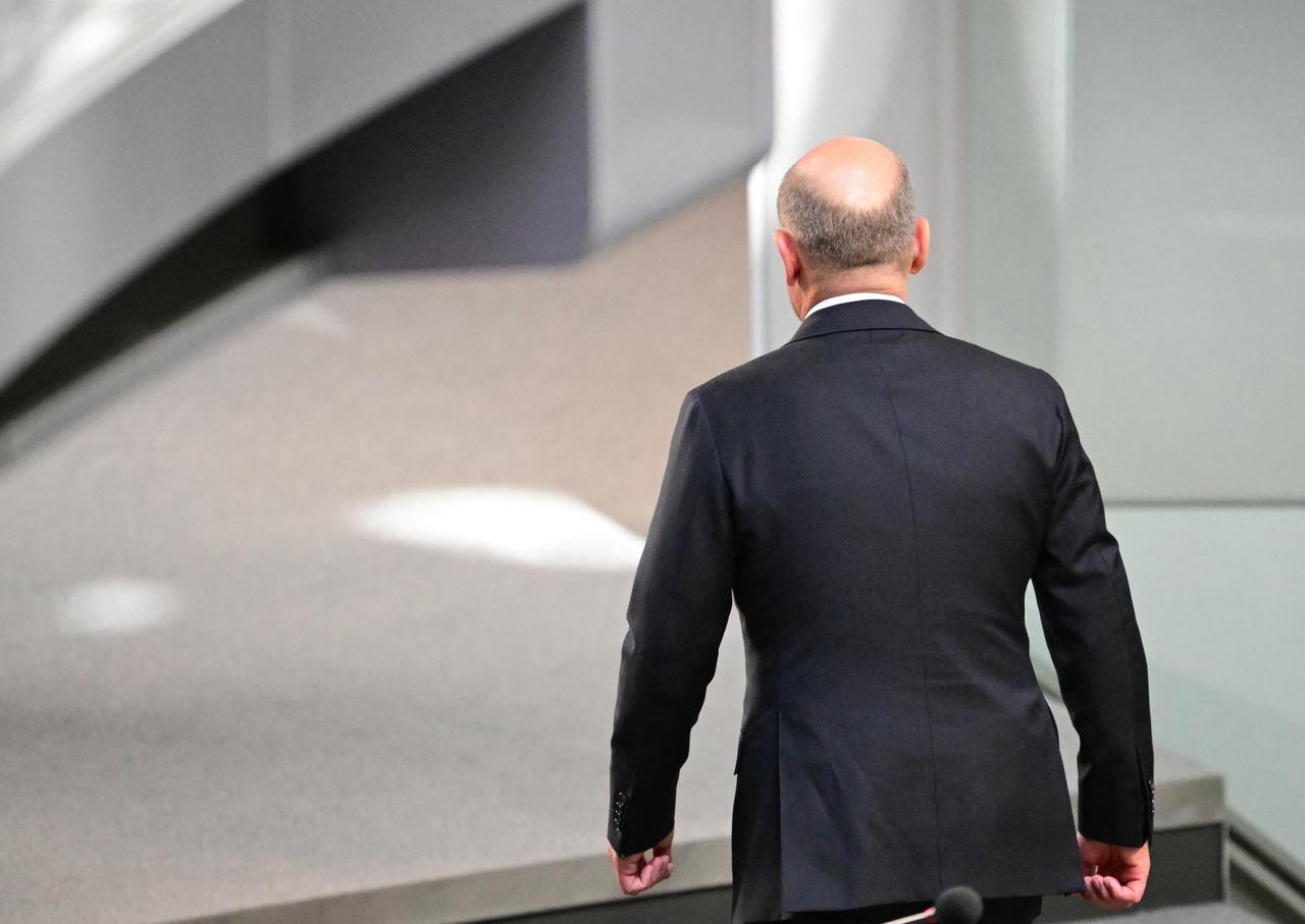 Outgoing German Chancellor Olaf Scholz leaves after the second round of voting during a session at the Bundestag (lower house of parliament), as MPs are to elect Germany's next Chancellor, in Berlin on May 6, 2025. (AFP Photo)