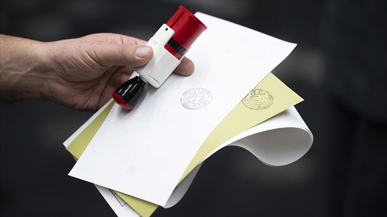 A voter holds official documents and a seal ahead of casting a ballot in Türkiye, accessed on May 6, 2025. (AA Photo)