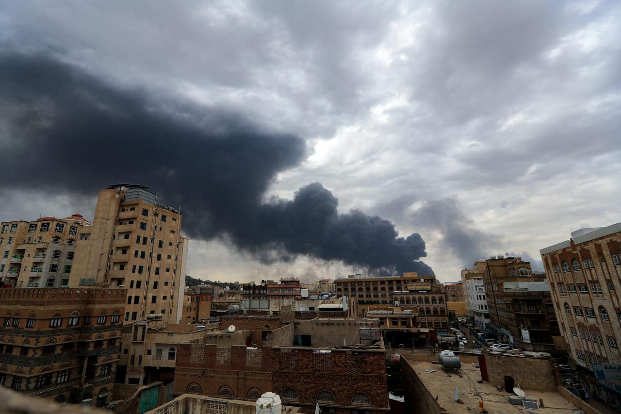 Smoke billows on the horizon following an Israeli air strike on Yemens Huthi-held capital Sanaa on May 6, 2025. Israeli air raids struck Yemens main airport and power stations in the Sanaa area on May 6, Huthi media and Israels military said, the latest retaliation for a missile attack by the Iran-backed rebels. (Photo by Mohammed HUWAIS / AFP)