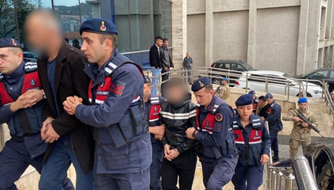 Turkish gendarmes escort a suspect outside a courthouse in connection with a case involving the death of an Afghan worker in Zonguldak, Türkiye, April 19, 2025. (IHA Photo)