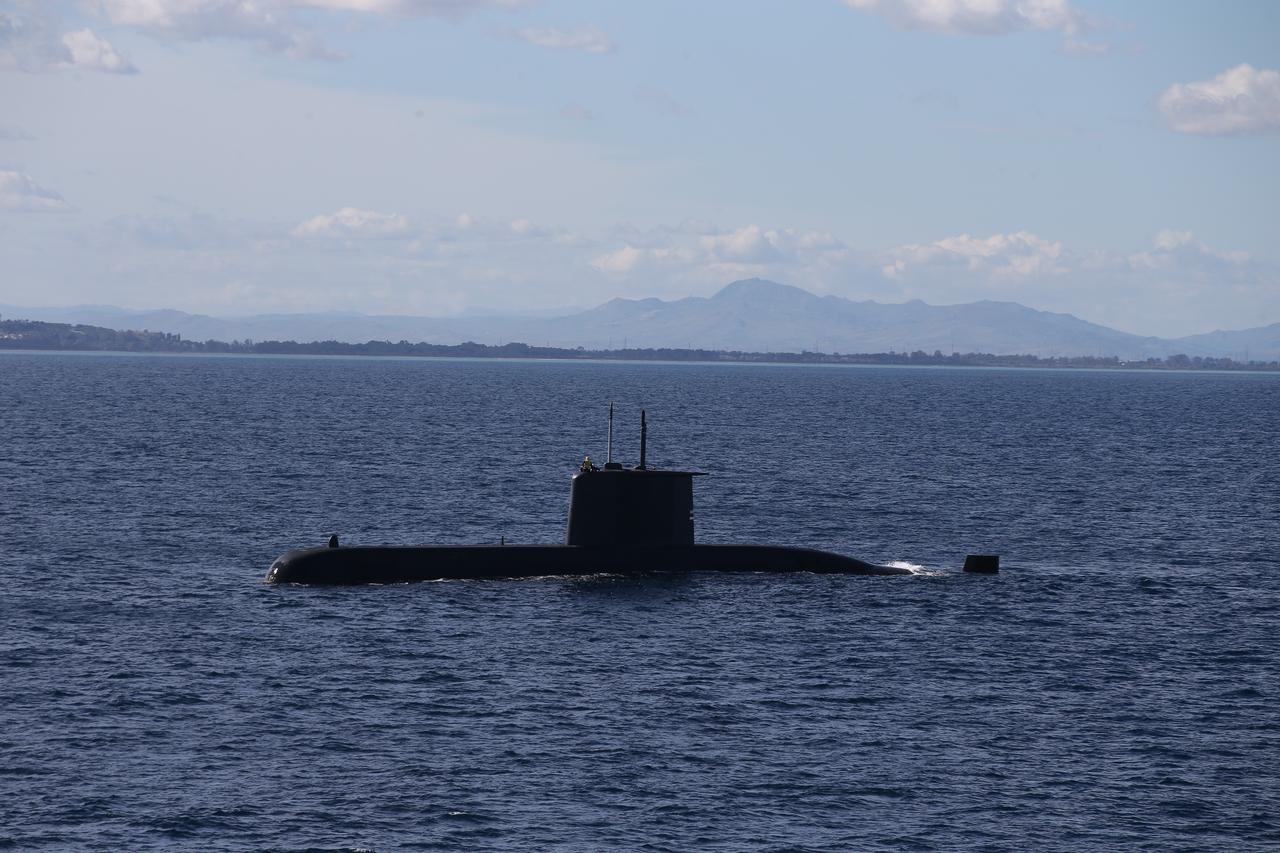 The Turkish Preveza-class submarine TCG Anafartalar (S-356) is seen on the sea surface during the NATOs Dynamic Manta 2024 exercise in the Mediterranean Sea off the coast of Sicily in Italy on February 26, 2024. (AA Photo)